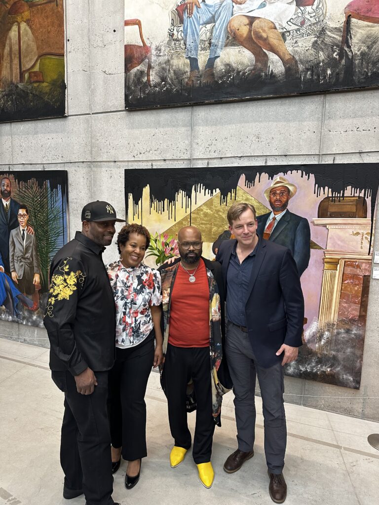 Nimbus Arts Center's Founding Artistic Director Samuel Pott stands for a photo alongside Bridge Art Gallery Co-Founders Cheryl and and Artist